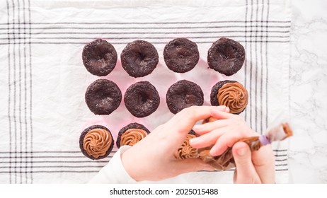 Flat Lay. Step By Step. Piping Chocolate Ganache Frosting On Top Of Chocolate Cupcakes.