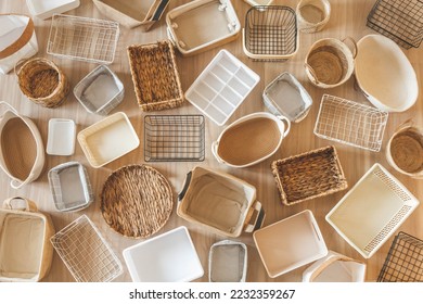 Flat lay of  storage boxes, containers and baskets with different sizes and shapes for tidying up wardrobe.  Japanese method organizer boxes set. Closet organizing concept.