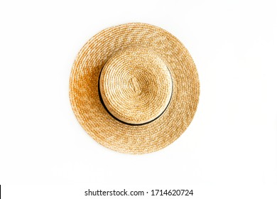 Flat lay of straw hat isolated on white background. Top view