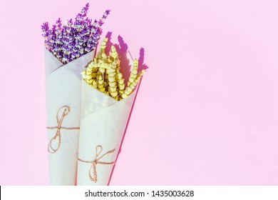 Flat Lay Style Composition Of Lemongrass And Lavender Herbs  Flower Wrapped Into Craft Paper On Colorful  Background.