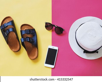 Flat Lay Style Of Summer Accessories And Travel Items On Colorful Background
