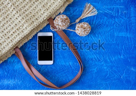 Flat lay of summer accessories, smartphone and camera. Summer outfit concept.