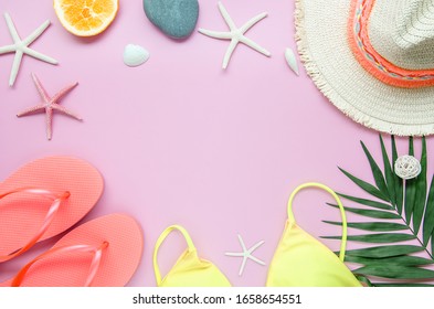 Flat Lay Summer Beach Frame Mockup. Female Hipster Traveler Accessories On A Pink Background. Palm Leaf, Rattan Bag And Hat. Copy Space