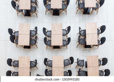 Flat Lay Tables In A Cafe Coworking In Rows In A Pattern, Top View.Coworking Spaces, Modern Office, Collaborative.overhead