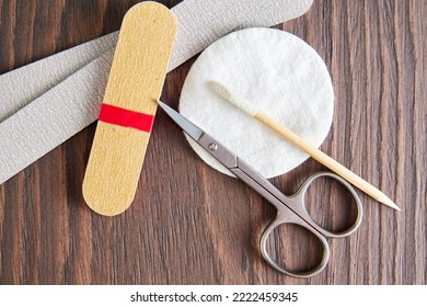 Flat Lay Template With Manicure Tools, Scissors, Nail File, Cotton Pad On The Worker Table. Health And Body Care Backgrounds