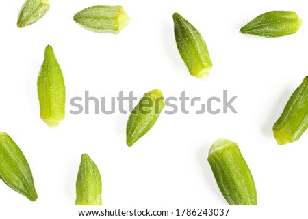 Flat lay texture made of green okra vegetables isolated on white background