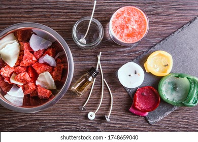 Flat Lay Of Tools For Reusing Old Candles Leftovers And Making Melting A New One: Various Ingredients On Table: Candle Wicks, Glass Jar, Old Candles Wax, Aroma Oil. 