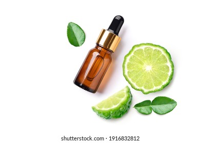 Flat lay (top view) of Bergamot essential oil with bergamot fruit sliced isolated on white background.