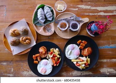 A Flat Lay Top View Of A Delicious Western Style Breakfast Spread On A Wooden Table.