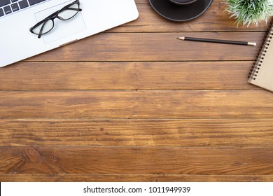 Flat Lay Of Top View Desk Work Table With Computer Laptop And Stationary In Home Office On Antique Brown Wood Table Includes Copyspace For Add Text Or Graphic