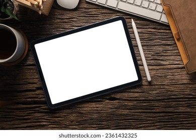 Flat lay, top view of digital tablet with blank display, laptop, notebook and coffee cup on wooden table. - Shutterstock ID 2361432325