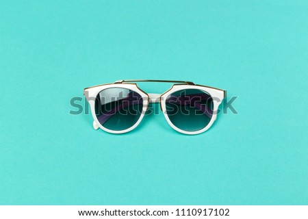 Flat lay. Top view. Fashion sunglasses on pastel background