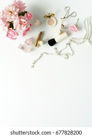 Flat Lay, Top View  Feminine Desk, Female Make Up Accessories, Cosmetics  And Bouquet Pink Roses.Beauty Concept.Copy Space