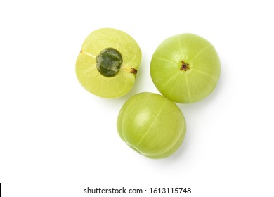 Flat lay (top view) of Fresh Indian gooseberry fruits with cut in half  isolated on white background. Clipping path.