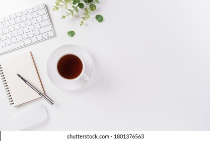 Flat lay, top view office table desk. Workspace with keyboard, office supplies, pencil and coffee cup with copy space on white background. - Powered by Shutterstock