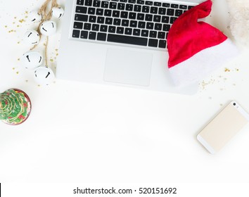 Flat Lay, Top View Office Table Desk. Workspace With Laptop And Christmas Decorations On White Background