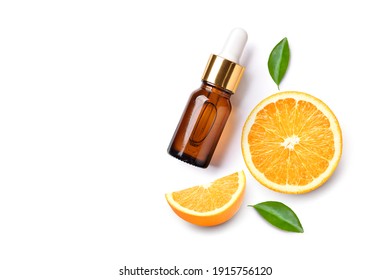 Flat lay (top view) Orange essential oil serum with orange fruit sliced  isolated on white background.