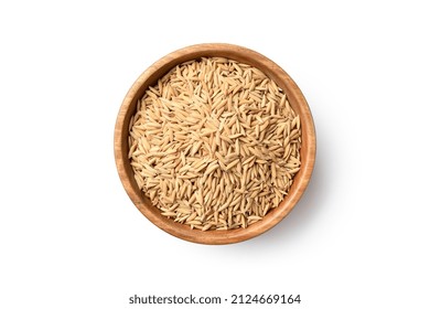Flat lay (top view) of paddy jasmine rice in wooden bowl isolated on white background. Clipping path.