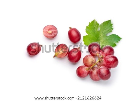 Flat lay (top view) of red grape with leaves on white background.