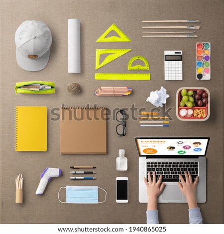 Flat lay top view of school supplies, distance learning and coronavirus concept.