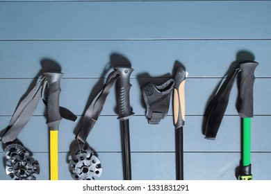 Flat lay top view of set of many hiking or ski poles on a wooden background - Powered by Shutterstock