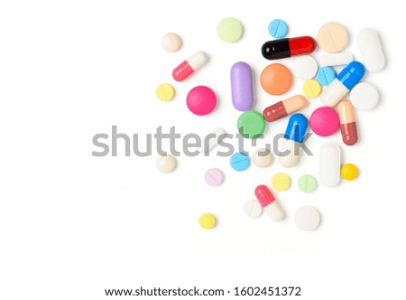 Flat lay (top view) of Various type of pills, tablets and capsules  isolated on white background.