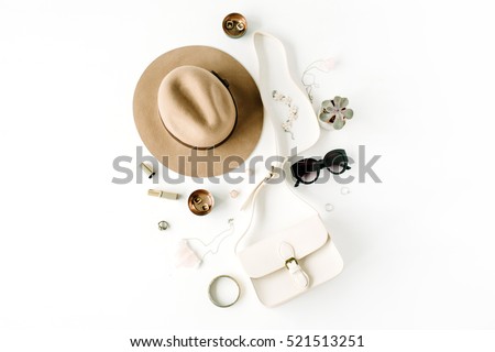 Flat lay trendy creative feminine accessories arrangement. Purse, hat, sunglasses, female accessories. Top view