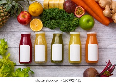 Flat Lay Of Various Kind Cold Pressed Juice In Bottle With Blank Label For Mock Up With Fruit And Vegetable Background, Healthy Eating Concept