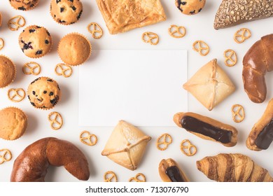 flat lay with various types of pastry and blank card isolated on white