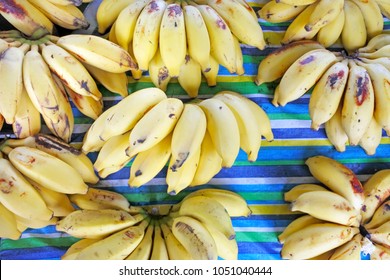 Flat Lay View Of Bunch Of Bananas For Sale In Rarotonga Market, Cook Islands. The High Content Of Potassium In Bananas Makes It A Super Fruit. Food Background And Texture. Copy Space