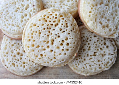 Flat Lay View Of English Crumpet Cakes. A Crumpet Is A Griddle Cake Made From Flour And Yeast. Food Background And Texture