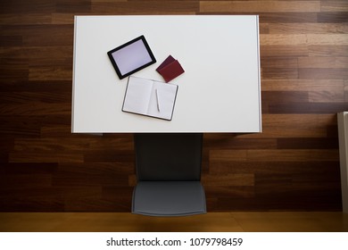 Flat lay with white gadgets and a diary