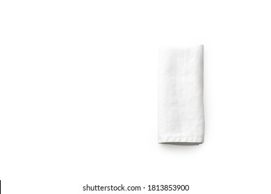 Flat lay with white linen kitchen napkin isolated on white background. Top view with folded cloth for mockup