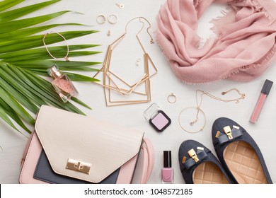 Flat lay with women accessories. Fashion, trends and shopping concept - Shutterstock ID 1048572185
