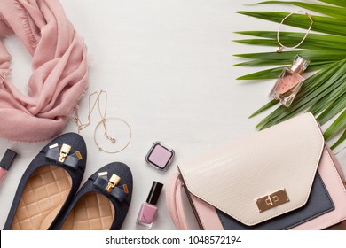 Flat lay with women accessories. Fashion, trends and shopping concept - Shutterstock ID 1048572194