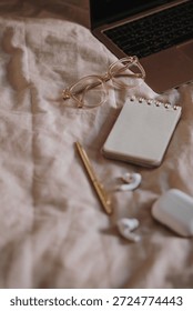 Flat Lay of Workspace Items on Soft Bedding