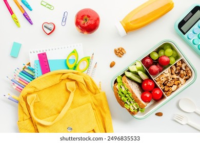 Flat lay yellow backpack, school supplies, a healthy lunchbox, and fresh fruits on a white background. Perfect for educational and lifestyle themes. - Powered by Shutterstock