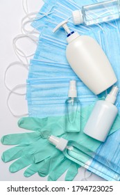 flat layout of hygiene items - latex gloves, mask and hand sanitizer or liquid soap isolated on white background with clipping parh