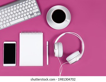 Flat layout on pink background. Horizontal photo. Composition of coffee cup, computer keyboard, headphones and notepad. online conference concept. desktop, office work and training. - Powered by Shutterstock