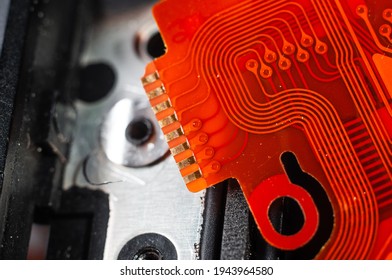 Flat orange flat cable for connecting a chip close-up, macro photography