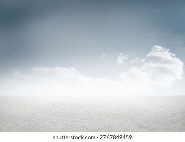 Flat pale ground surface is extending into horizon in flat design, with soft gradient sky. Minimalist, expansive, barren, outdoors, tranquility, natural, scenic
