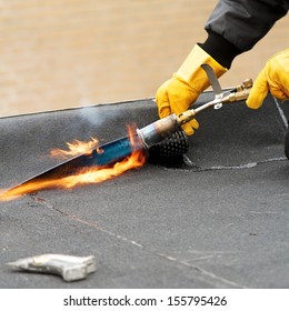 Flat roof repairing with roofing felt