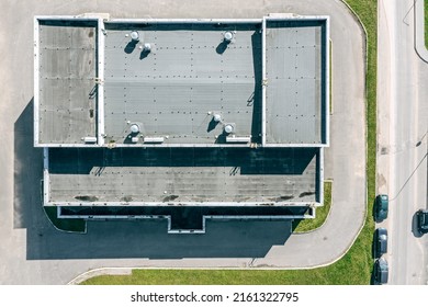 Flat Shingle Roof Of Industrial Building With Ventilation Systems. Aerial Top View