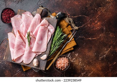 Flat slices of square sandwich ham with herbs. Dark background. Top view. Copy space. - Shutterstock ID 2239238549