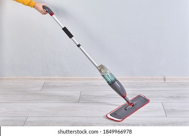 Flat Spray Mop For Cleaning Floor With Microfiber Cloth And Spraying Bottle.