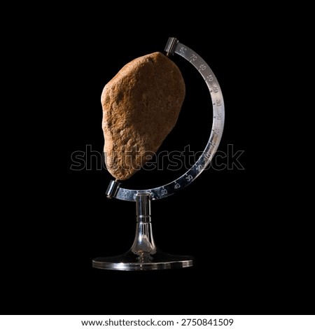 Flat stone placed in globe stand, concept of flat earth theory and pseudoscience