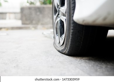 Flat Tire Accident In Car Park On The Street Waiting For Repair.flat Tire And Spare Concept.copy Space, 