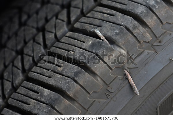 Flat tire. Attaching a\
spare wheel. Lifting the car on the jack. Accident with punctured\
tires.