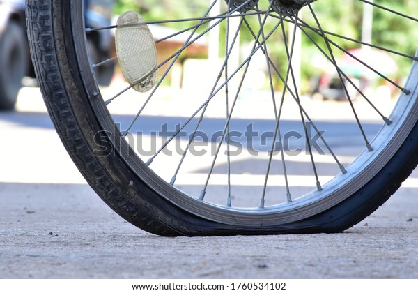 \
The flat tire of a\
bicycle.