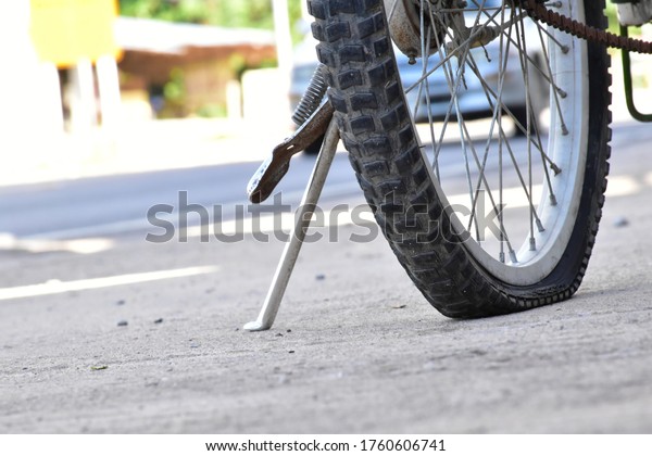 \
The flat tire of a\
bicycle.